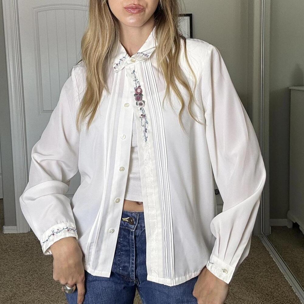White vintage blouse with embroidered details on the collar and cuffs